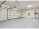 Two-car garage with epoxy floor and water softener at 157 Sarabeth St, Las Vegas, NV 89138