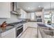 Modern kitchen with granite countertops and stainless steel appliances at 1934 Karner Blue Ave, North Las Vegas, NV 89031