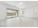 Bright and airy living room with sliding glass doors leading to backyard at 2169 Radiant Horizon Ave, Henderson, NV 89052