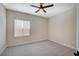 Spacious bedroom with ceiling fan, neutral walls, and carpet flooring at 2603 Savannah Springs Ave, Henderson, NV 89052