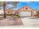 Single-story house with a two-car garage and desert landscaping at 2612 Springridge Dr, Las Vegas, NV 89134