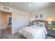 Spacious bedroom with a comfortable bed and ensuite bathroom at 2646 Snapdragon Falls Ave # 92, North Las Vegas, NV 89081