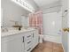 Bathroom with double vanity, shower/tub combo, and tile flooring at 310 Coral Fountain St, Henderson, NV 89014