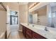 Double vanity bathroom with a view of the bedroom at 315 Mali Heights Ct, Henderson, NV 89074