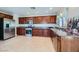 Modern kitchen featuring wood cabinets and granite countertops at 315 Mali Heights Ct, Henderson, NV 89074