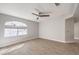 Spacious bedroom with light wood flooring and arched window at 3244 Epson St, Las Vegas, NV 89129