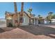 View of house exterior with a walkway and mature palm trees at 3245 W Landberg Ave, Las Vegas, NV 89141