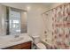 Bathroom with a tub, shower, and floral shower curtain at 445 Venticello Dr, Las Vegas, NV 89138