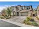 Beautiful two-story home with stone exterior and landscaped yard at 445 Venticello Dr, Las Vegas, NV 89138