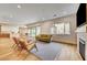 Light and airy living room with wood floors and modern furniture at 445 Venticello Dr, Las Vegas, NV 89138