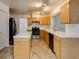 Kitchen with stainless steel appliances and light wood cabinets at 4516 Ryder Ln, North Las Vegas, NV 89031