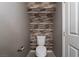 Small half-bathroom with wood-like wall accents at 4772 Double Down Dr # 102, Las Vegas, NV 89122