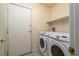 Laundry room with Samsung washer and dryer, and shelving at 4772 Double Down Dr # 102, Las Vegas, NV 89122