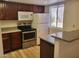 Kitchen with granite counters and appliances at 5278 River Glen Dr # 417, Las Vegas, NV 89103