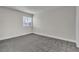 Well-lit bedroom with gray carpeting and a large closet at 5450 Black Rock Way, Las Vegas, NV 89110