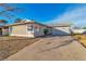 Front view of a single story house with a garage and driveway at 5450 Black Rock Way, Las Vegas, NV 89110