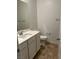 Clean bathroom with white vanity and tiled floor at 7368 N Decatur Blvd # 1, Las Vegas, NV 89131