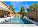 Relaxing pool area with a water feature and patio at 8727 Moon Crater Ave, Las Vegas, NV 89178