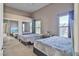 Spacious bedroom with mirrored closet doors and two beds at 8985 S Durango Dr # 2038, Las Vegas, NV 89113