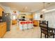 Kitchen with light wood cabinets, island, and red bar stools at 9116 Ironstone Ave, Las Vegas, NV 89143