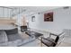 Modern living area with gray sofa and metal framed chairs at 945 Vegas Valley Dr, Las Vegas, NV 89109