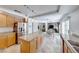 Spacious kitchen with granite island, stainless steel appliances, and wood cabinets at 10681 Wildhurst St, Las Vegas, NV 89183