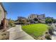 Community park with a walking path, bench, and grassy area at 15 Santo Mio Ct, Henderson, NV 89011