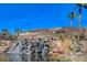 Stunning view of a waterfall cascading into a pond at 15 Santo Mio Ct, Henderson, NV 89011