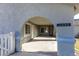 Covered entryway with arched entry and concrete flooring at 2440 Robison Farm Rd, Logandale, NV 89021