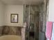 Bathroom with shower and bathtub at 440 Pioneer St, Henderson, NV 89015