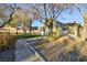 Landscaped yard with walkway leading to a charming home at 4966 Droubay Dr, Las Vegas, NV 89122