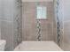 Clean bathroom with shower/tub combo and tile surround at 513 N Minnesota St, Las Vegas, NV 89107