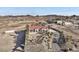 Aerial view of a single-story house with red tile roof, palm trees, and a large yard at 531 N Milan St, Henderson, NV 89015