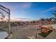 Landscaped backyard with a birdcage and stunning sunset views at 531 N Milan St, Henderson, NV 89015