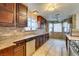 Kitchen with stainless steel appliances and wood cabinets at 6105 Heather Mist Ln, Las Vegas, NV 89108