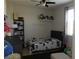 Small bedroom with a bed, shelf and toys at 647 Wounded Star Ave, Las Vegas, NV 89178