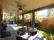 Covered patio with ceiling fan and backyard access at 647 Wounded Star Ave, Las Vegas, NV 89178