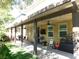 Covered patio features ceiling fan and backyard access at 647 Wounded Star Ave, Las Vegas, NV 89178