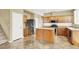 Spacious kitchen featuring granite countertops, stainless steel appliances, and an island at 6491 Bristle Canyon Ave, Las Vegas, NV 89110