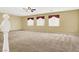 Large living room featuring carpet and ceiling fan at 6491 Bristle Canyon Ave, Las Vegas, NV 89110