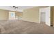 Spacious living area with carpeting and ample natural light at 6491 Bristle Canyon Ave, Las Vegas, NV 89110