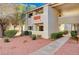 Attractive exterior of a two-story building with landscaping and walkway at 7300 Pirates Cove Rd # 1056, Las Vegas, NV 89145