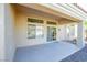 Covered patio with sliding glass doors and ceiling fan at 10008 Hope Island Dr, Las Vegas, NV 89134