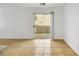 Light-filled dining area with tiled floor and sliding glass door to patio at 10064 Fragile Fields St, Las Vegas, NV 89183