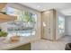 Kitchen with green cabinets, marble countertops and a view of the backyard at 10981 Laureldale Ct, Las Vegas, NV 89141