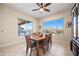 Bright dining room with wooden table and backyard view at 1143 Tortoise Mountain Dr, Mesquite, NV 89034