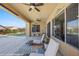 Relaxing covered patio with comfortable seating and ceiling fans at 1143 Tortoise Mountain Dr, Mesquite, NV 89034