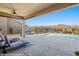 Covered patio overlooking a sparkling pool and relaxing backyard at 1143 Tortoise Mountain Dr, Mesquite, NV 89034