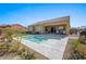 Inviting backyard pool with a large patio and landscaping at 1143 Tortoise Mountain Dr, Mesquite, NV 89034