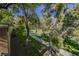 Pathway through a tree-lined area at 1424 Country Hollow Dr, Las Vegas, NV 89117